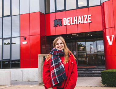 Delhaize Belgium colleague standing in front of the head office.